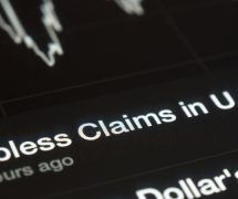 U.S. initial jobless claims graph on a tablet screen. (Photo: AdobeStock)
