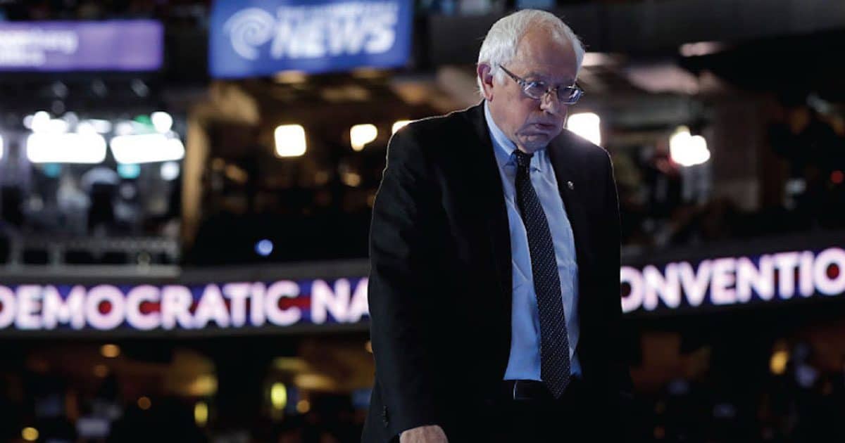 Bernie Sanders stands at the podium on stage during a walk through before the start of the Democratic National Convention (DNC) in Philadelphia, Pennsylvania on July 25, 2016. (Photo: SS)