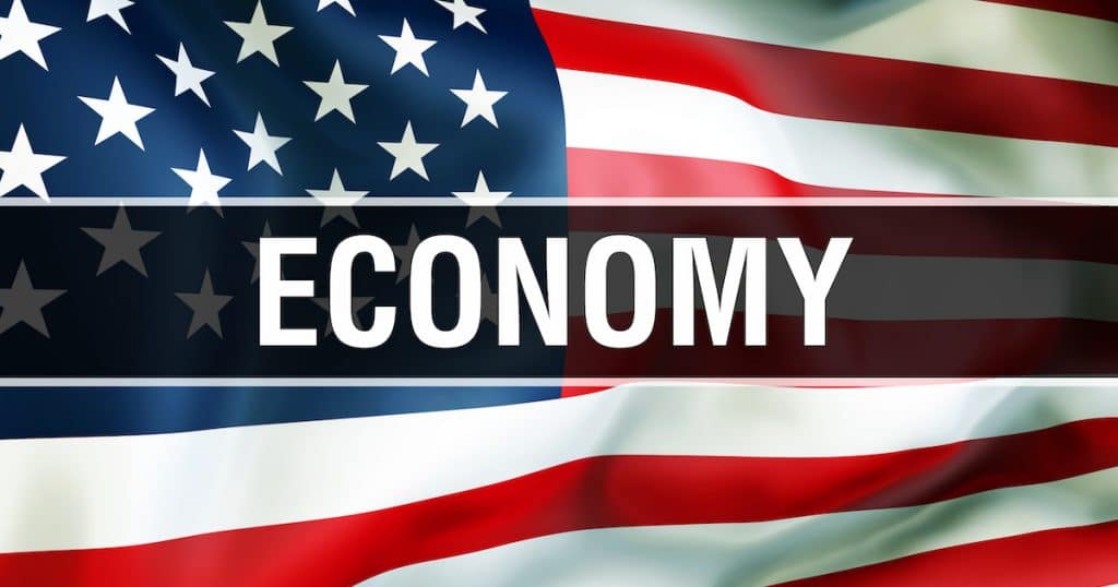 U.S. economy on an American flag background waving in the wind, in 3D rendering. (Photo: AdobeStock)