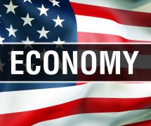 U.S. economy on an American flag background waving in the wind, in 3D rendering. (Photo: AdobeStock)