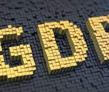 Gross domestic product (GDP) graphic concept with yellow square pixels on a black matrix background. (Photo: AdobeStock)