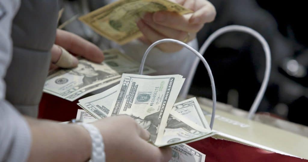 People count money at Macy's Herald Square store during the early opening of the Black Friday sales in the Manhattan borough of New York, November 26, 2015. (Photo: Reuters)