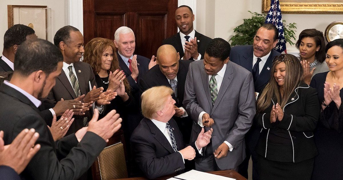 Donald Trump hands a pen to Isaac Newton Farris Jr. after signing a proclamation in honor of Martin Luther King Jr. Day. January 2018. (Photo: Official White House)