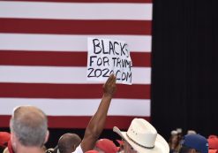 An African American supporter of President Donald Trump holds up a Black for Trump sign during a rally in Tampa, Florida on Tuesday, July 31, 2018. (Photo: Laura Baris/People's Pundit Daily)