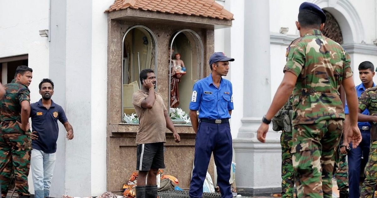 People gather outside St. Anthony's Shrine where a blast happened, in Colombo, Sri Lanka, Sunday, April 21, 2019. (Associated Press)
