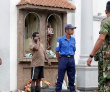 People gather outside St. Anthony's Shrine where a blast happened, in Colombo, Sri Lanka, Sunday, April 21, 2019. (Associated Press)