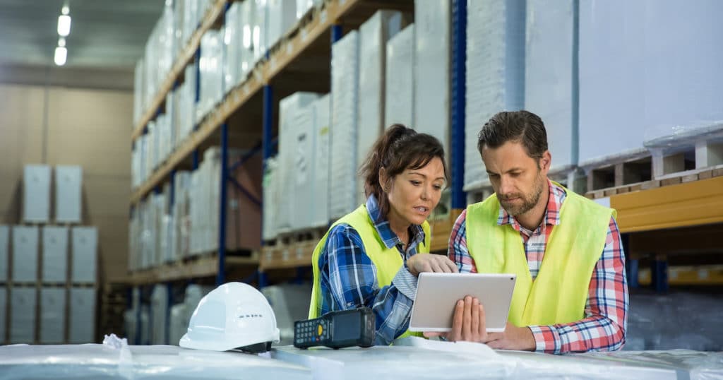 Employees have short meeting in the warehouse to check business inventory levels of goods. First in first out. (Photo: AdobeStock)