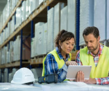 Wholesale inventories concept depicting by employees having short meeting in the warehouse to check levels of business inventories. First in first out. (Photo: AdobeStock)