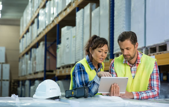 Wholesale inventories concept depicting by employees having short meeting in the warehouse to check levels of business inventories. First in first out. (Photo: AdobeStock)