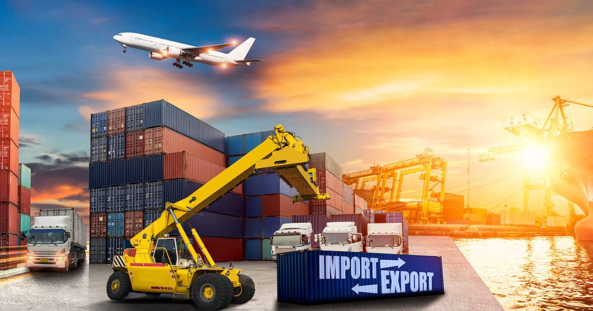 Logistics and transportation of import export container cargo ship, cargo plane with working crane bridge in shipyard at sunrise, logistic import export and transport industry background. (Photo: ADobeStock)