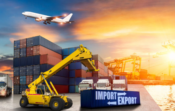 Logistics and transportation of import export container cargo ship, cargo plane with working crane bridge in shipyard at sunrise, logistic import export and transport industry background. (Photo: ADobeStock)