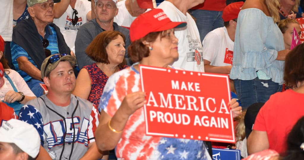 A support of President Donald Trump holds up a "Make America Proud Again" sign during a rally in Tampa, Florida on Tuesday, July 31, 2018. (Photo: Laura Baris/People's Pundit Daily)