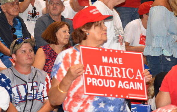 A support of President Donald Trump holds up a 
