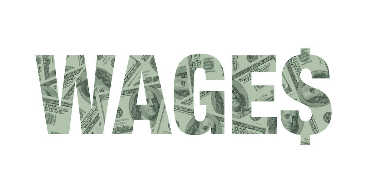 Wages, or average hourly earnings (AHE), graphic concept depicted in hundred dollar bills. (Photo: AdobeStock)