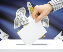 Voting, elections and state polls concept: Ballot box with state flag in the background - Louisiana. (Photo: AdobeStock)