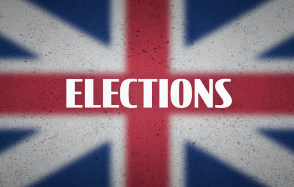 UK Elections on blurred Union Jack flag. The graphic illustration and concept for British elections. (Photo: AdobeStock)