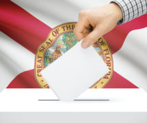 Voting, elections and state polls concept: Ballot box with state flag in the background - Florida. (Photo: AdobeStock)
