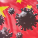 China coronavirus cells to illustrate epidemic pandemic flu virus infection, with a Chinese flag background. (Photo: AdobeStock)