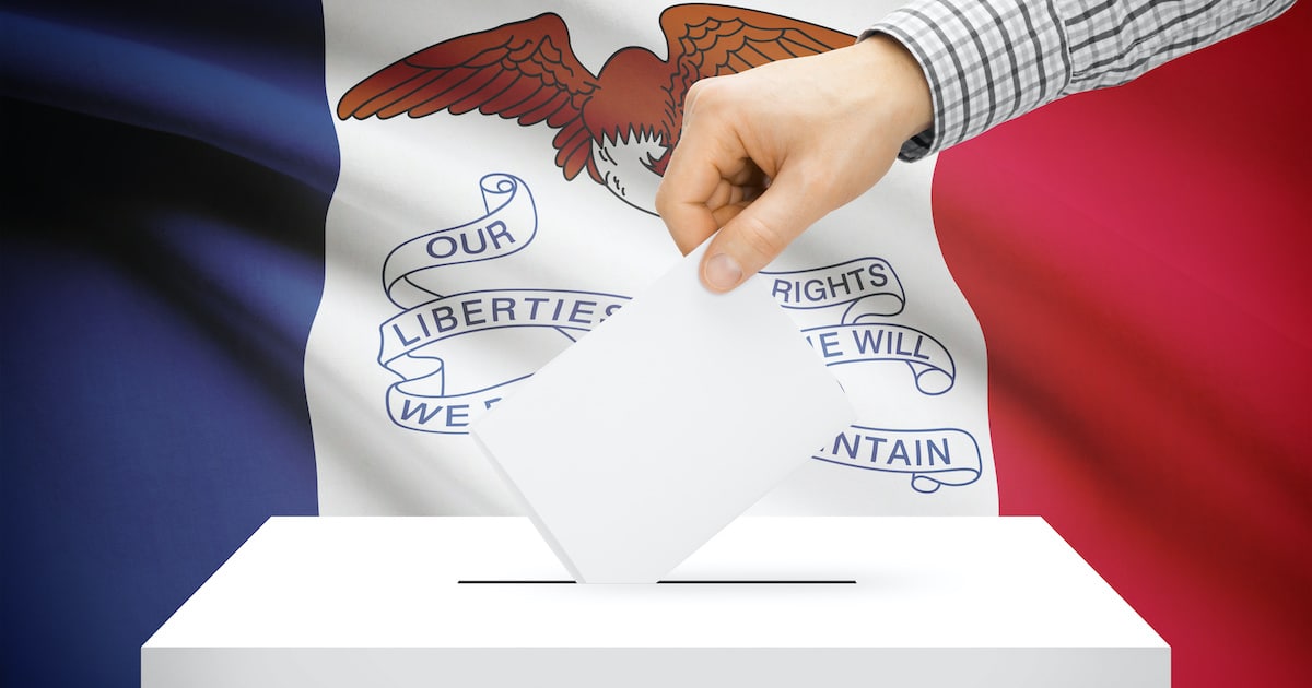 Voting, elections and state polls concept: Ballot box with state flag in the background - Iowa. (Photo: AdobeStock)