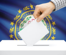 Voting, elections and state polls concept: Ballot box with state flag in the background - New Hampshire. (Photo: AdobeStock)
