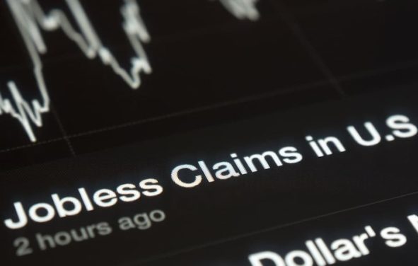 U.S. initial jobless claims graph on a tablet screen. (Photo: AdobeStock)