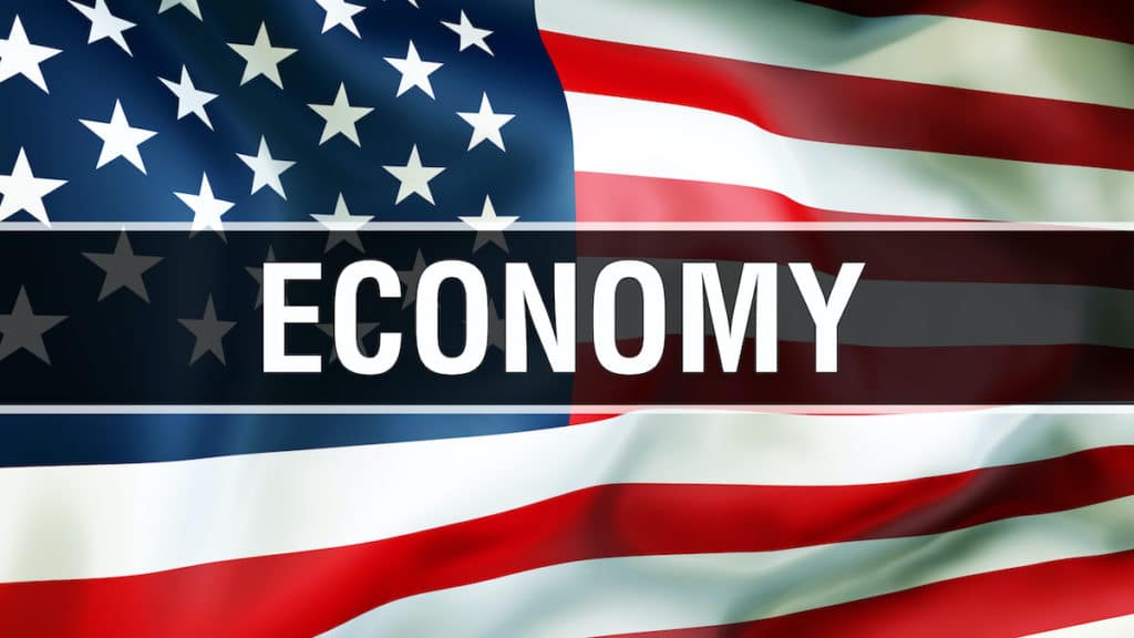 U.S. economy on an American flag background waving in the wind, in 3D rendering. (Photo: AdobeStock)