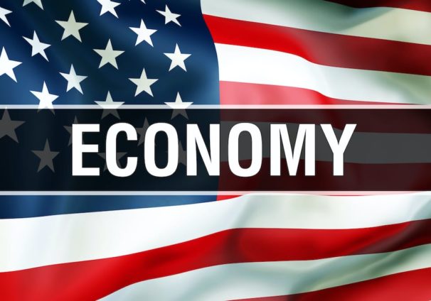U.S. economy on an American flag background waving in the wind, in 3D rendering. (Photo: AdobeStock)