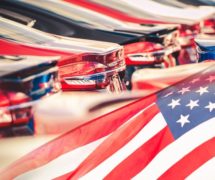 Buying American Made Cars. Supporting the American auto industry and economy photomontage with automobiles and the American Flag. (Photo: AdobeStock)