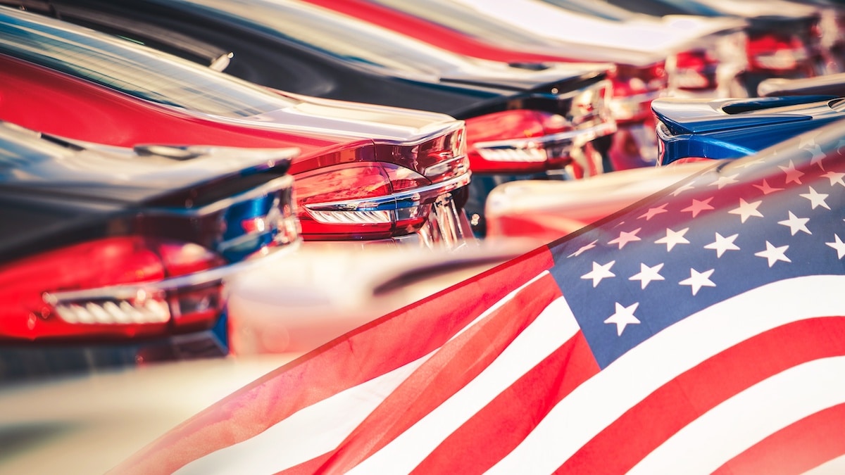 Buying American Made Cars. Supporting the American auto industry and economy photomontage with automobiles and the American Flag. (Photo: AdobeStock)