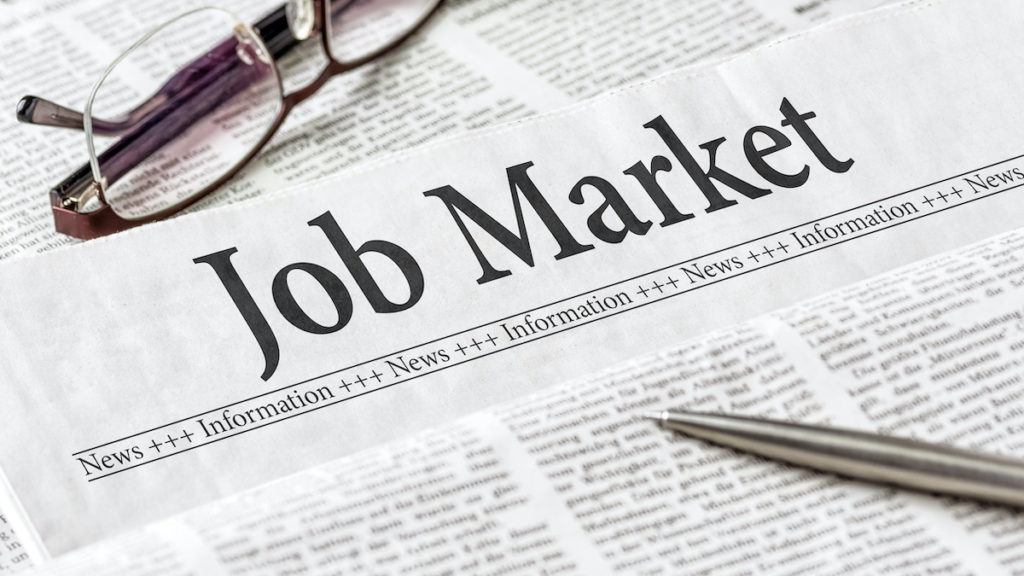 A newspaper with the headline "Job Market". (Photo: AdobeStock)